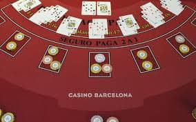 Live dealer blackjack table with croupier and players at joki123